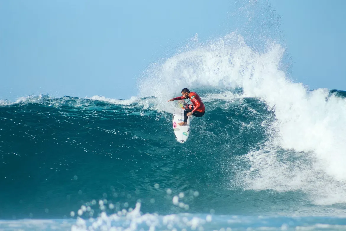 Surfer carving a large wave